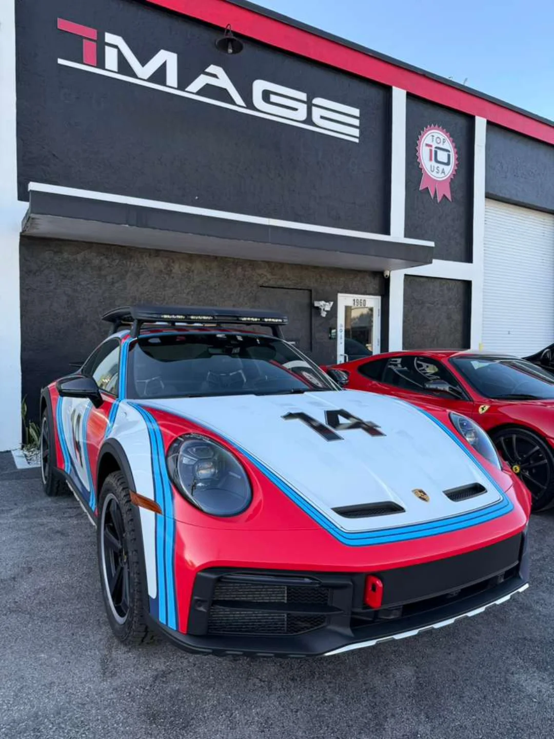 Porsche 911 Dakar in Martini livery outside the IMAGE shop